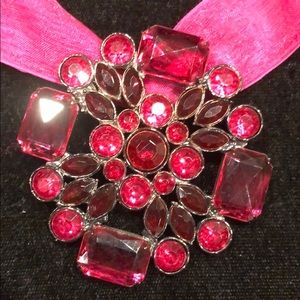 Pink necklace with a pink ribbon. Costume jewelry.